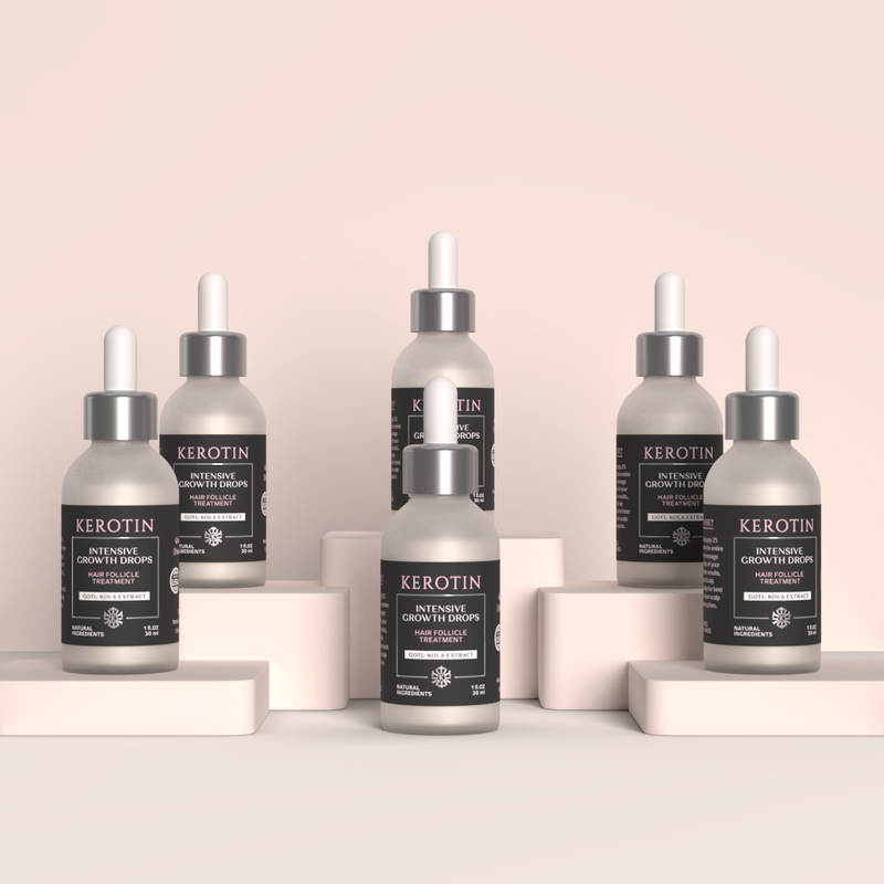 Six Kerotin Intensive Growth Drops arranged on a minimalist beige platform set against a soft blush background.